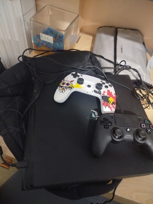 Sony PlayStation 4 Pro 1TB console with 2 controllers and 7 games