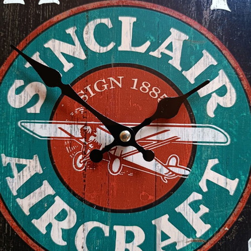 Sinclair Aircraft retro wall clock with airplane design
