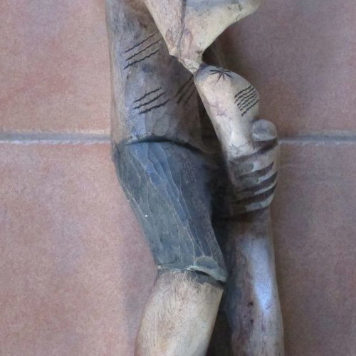 Wooden carved figure used from Colombia with traditional Pan flute