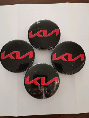 Kia 58mm wheel center caps new, black with red letters