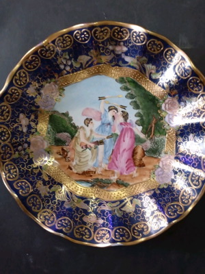 Decorative porcelain plate used with mythological scene