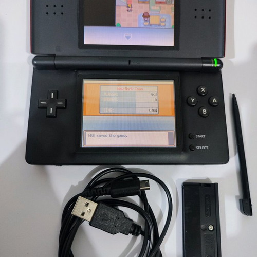 Nintendo DS Lite console used with Pokemon LeafGreen cartridge and accessories