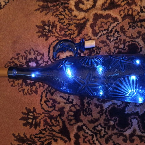 Bottle with LED light like new, blue and red