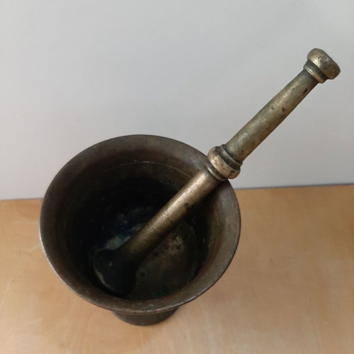 Old mortar with pestle used, vintage decoration