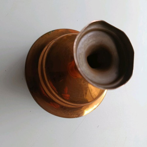 Copper decoration with two old coins used