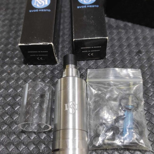 Kayfun V5 atomizer used with glass and steel tank