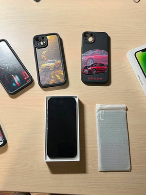 Apple iPhone 14 128GB Midnight with 4 cases and 4 screen protectors