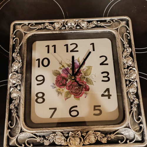 Square analog clock with embossed silver rose frame, like new
