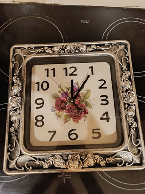 Square analog clock with embossed silver rose frame, like new