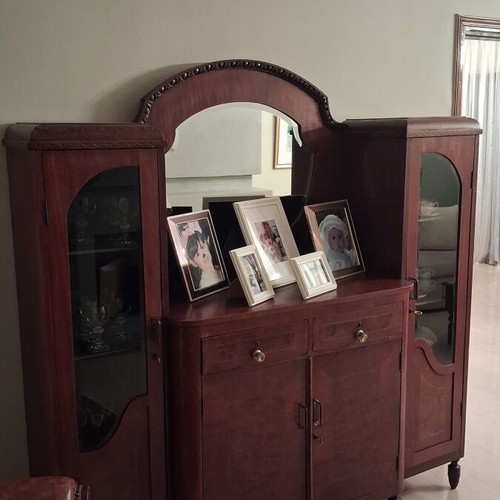 Large wooden antique sideboard with glass cabinets and mirror