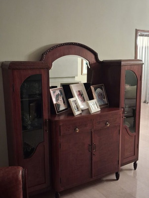 Large wooden antique sideboard with glass cabinets and mirror