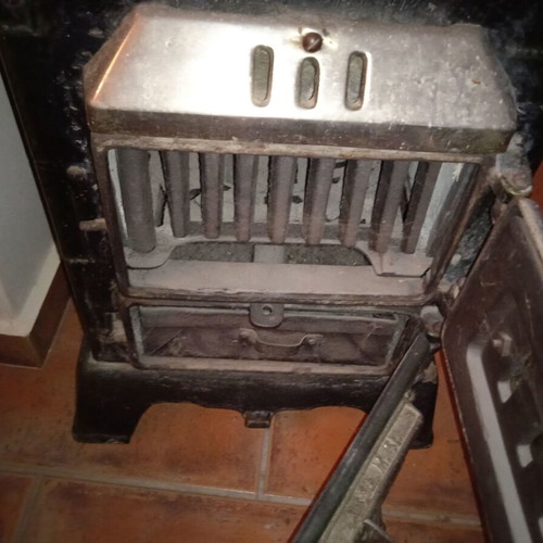 Cast iron stove used for briquettes and wood