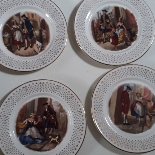 Set of four used French wall plates with gold designs 23cm