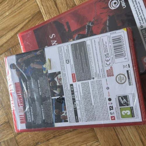 Nintendo Switch 2 games package NBA 2K26 and Assassin's Creed Shadows, sealed
