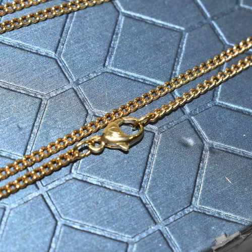 Swarovski necklace with saxophone pendant and crystal like new, gold plated
