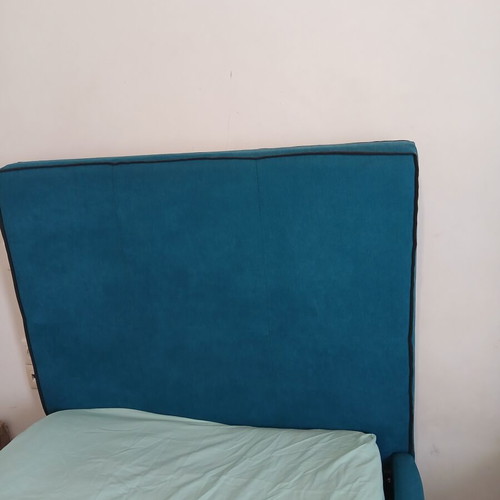Single bed with teal fabric headboard and mattress, like new