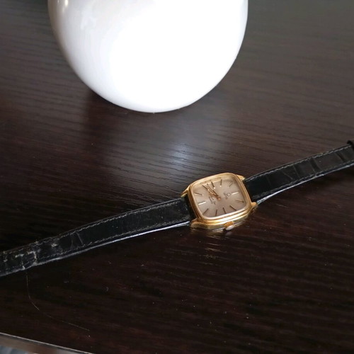 Venus women's watch like new with black leather strap and gold details