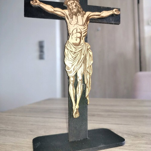 Handmade cross with embossed Jesus figure on laser cut wood