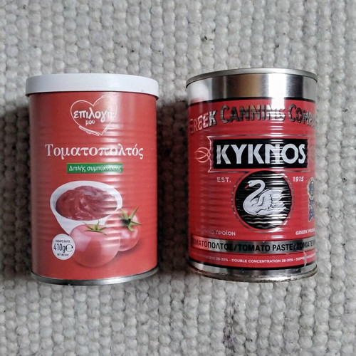 Empty tomato paste cans used for crafts