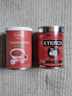 Empty tomato paste cans used for crafts
