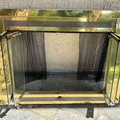 Metallic bronze fireplace screen used, gold tone