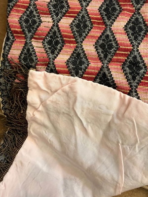 Handmade embroidered table runner with diamond pattern