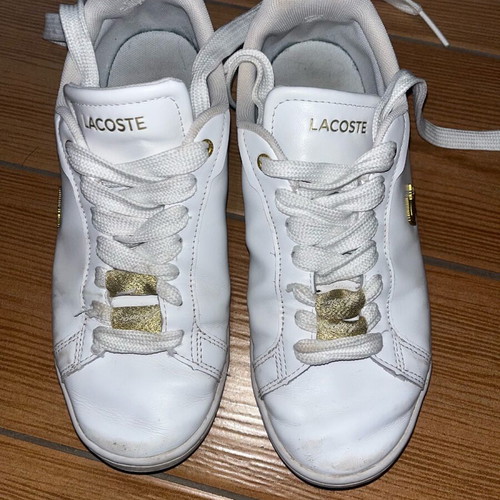 Lacoste sneakers used leather with gold details