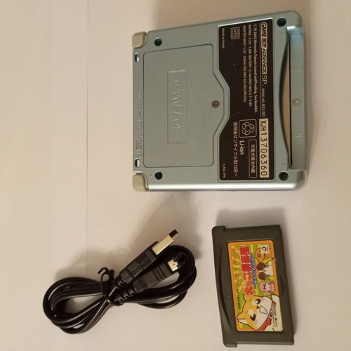 Gameboy Advance SP console with Inukko Club game and USB charger