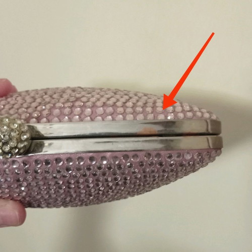 Accessorize pink clutch bag