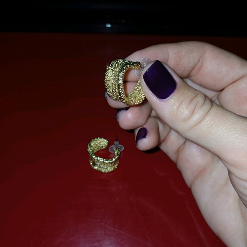 Earrings with textured surface in yellow color like new