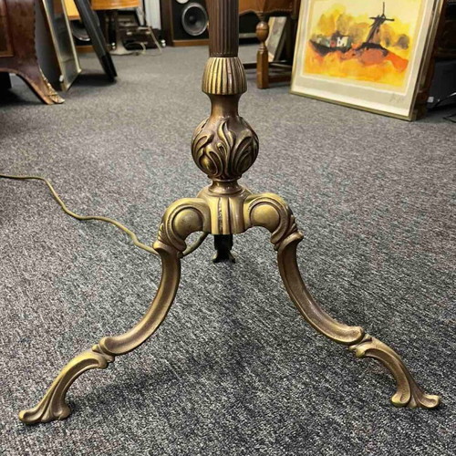 Vintage floor lamp used with ornate metal base and pleated fabric shade