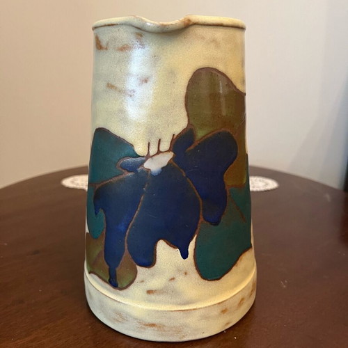 Handmade earthenware jug new with embossed floral pattern