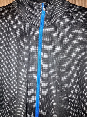 Crivit cycling jacket used, black with blue details, size Large 52/54