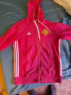Manchester United jacket authentic used with small chlorine stain