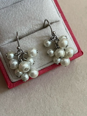 Earrings in like new condition, white and silver