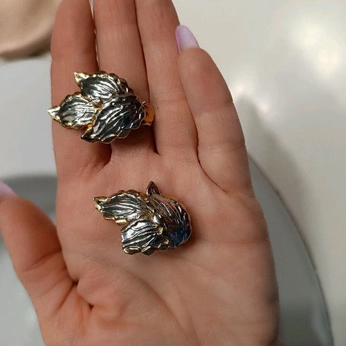 Silver and gold leaf-shaped earrings like new