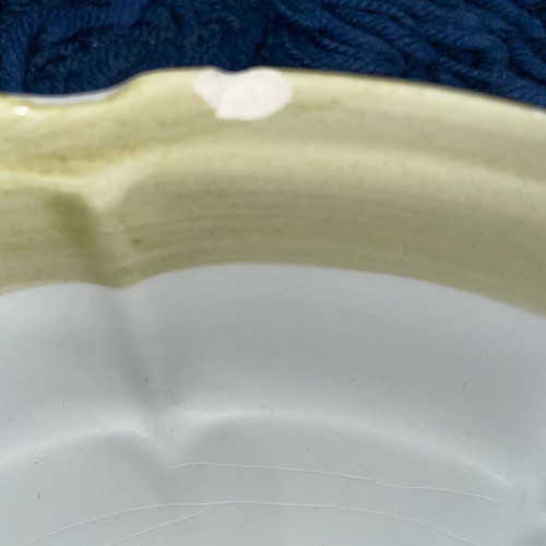 Ceramic serving dish used with artichoke design