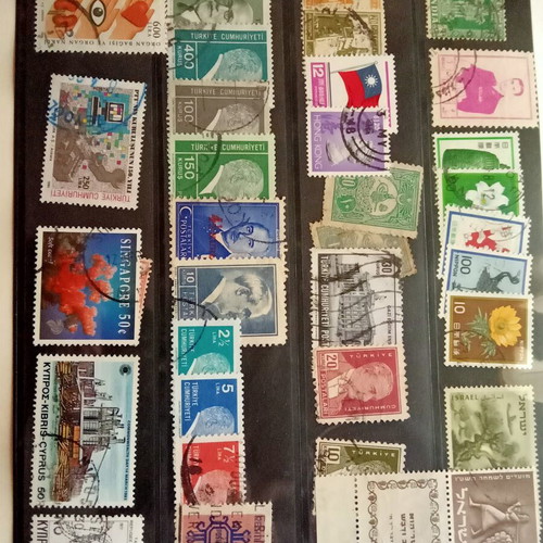Stamp album with some stamps, mostly cancelled