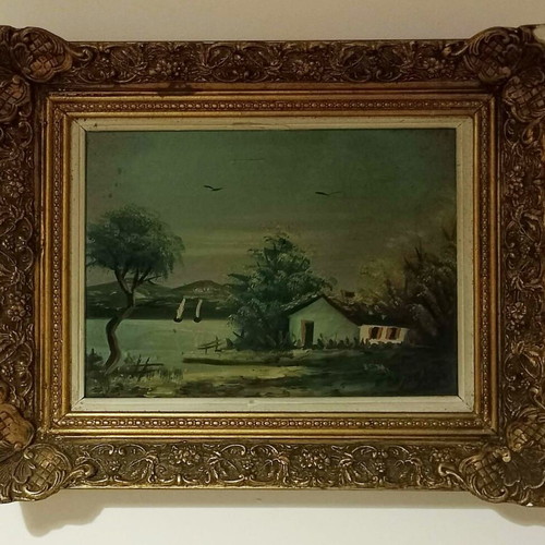 Painting used with house by lake theme and ornate frame