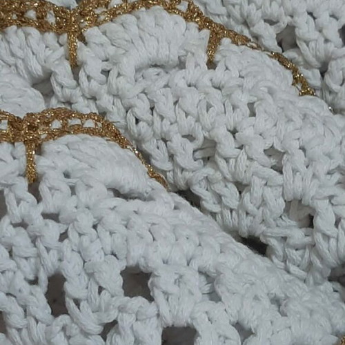 Elegant handmade white table set with gold details and napkin rings