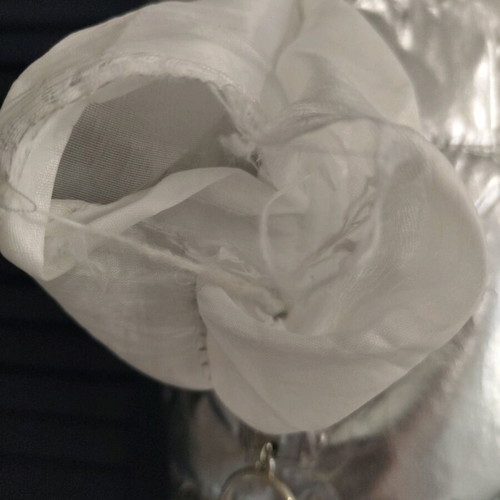Silver sleeveless jacket used for girls aged 9-11 years