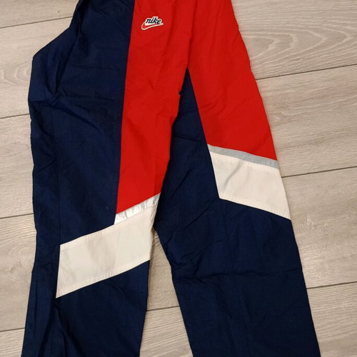 Nike track pants used, navy with red stripes