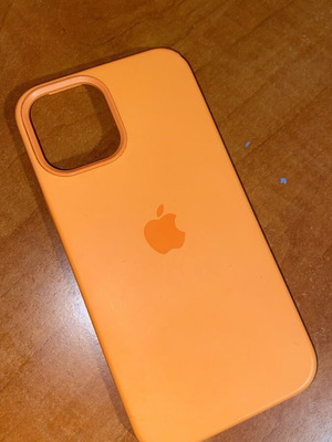 Neon Orange iPhone Pro case used with imperfection
