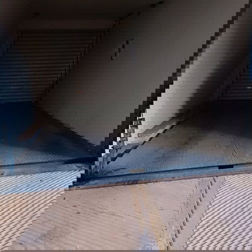 Underground parking space with car elevator, Athens Three Bridges