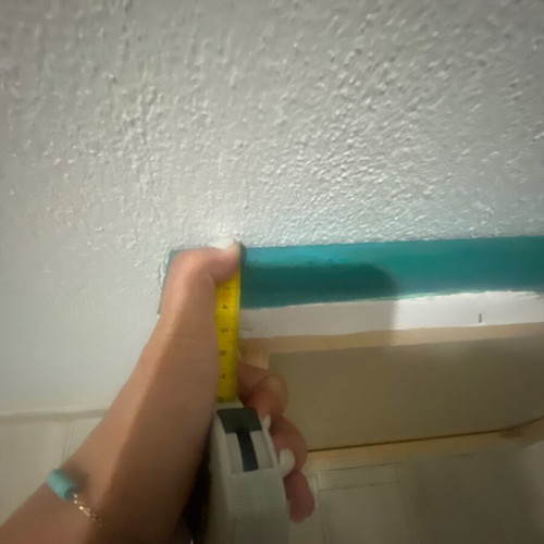 Turquoise board with a gold hamsa hand