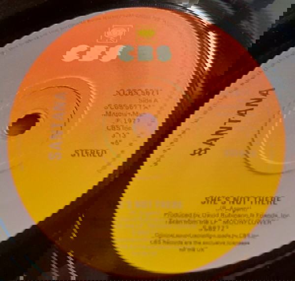SANTANA ~ SHE'S NOT THERE / ZULU (1977, CBS, 7" single, αυθεντική UK έκδοση)