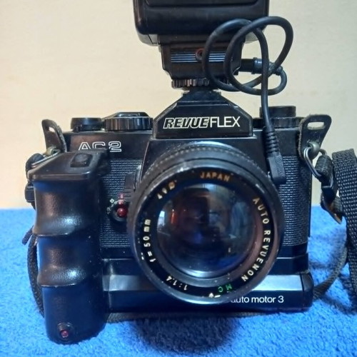 Revueflex AC2 35mm SLR film camera used with Sunpak Auto 26 DX flash