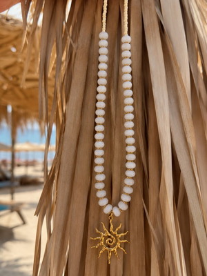 Handmade white and gold necklace with sun pendant