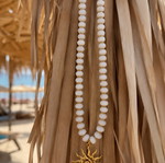 Handmade white and gold necklace with sun pendant