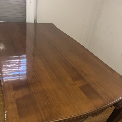 Wooden dining table used with carved legs and metal details